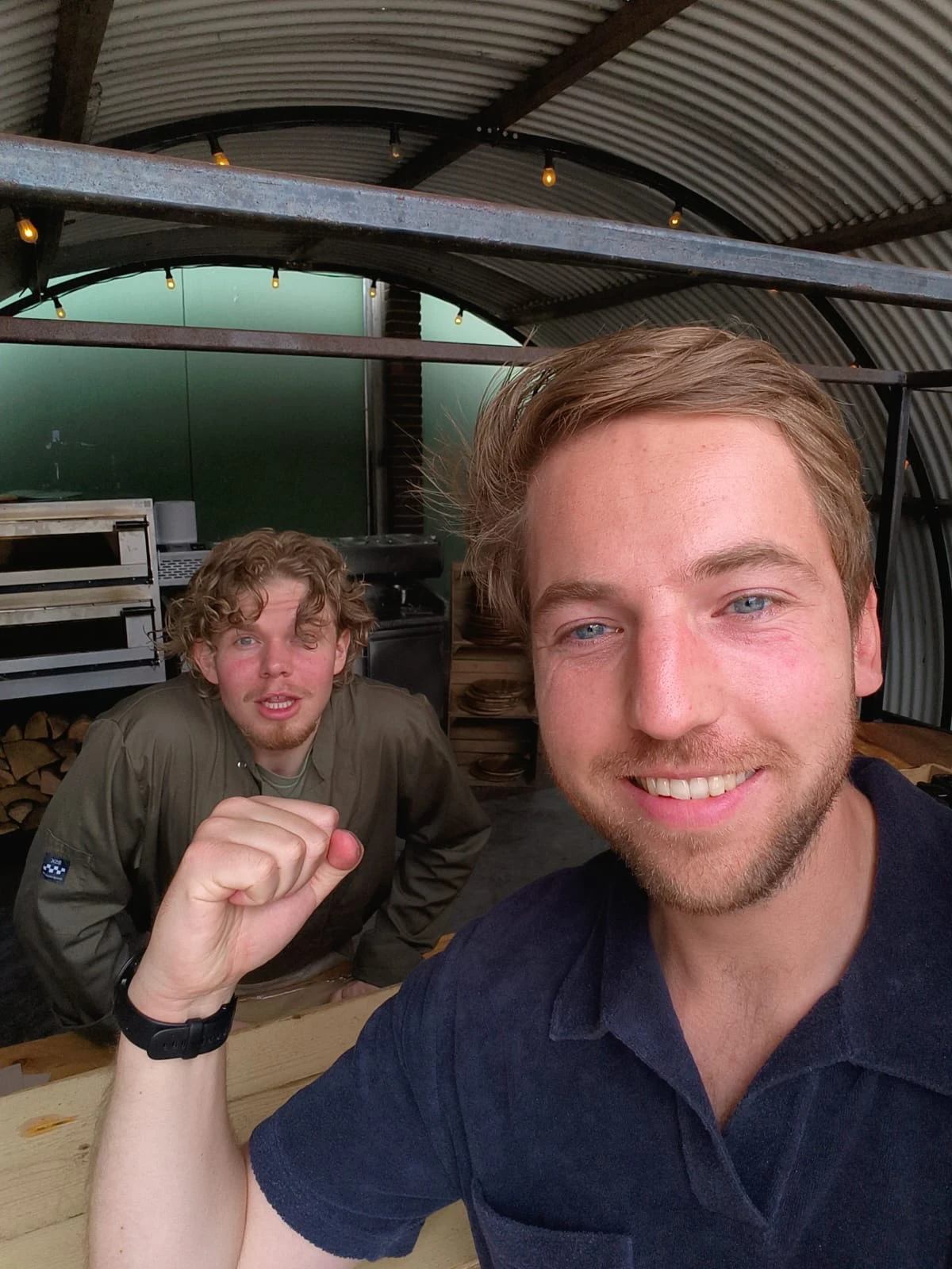 At Fort aan de Klop with a team member at the pizza oven